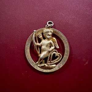 Monet Gold Brooch with Textured Border and Seated Figure